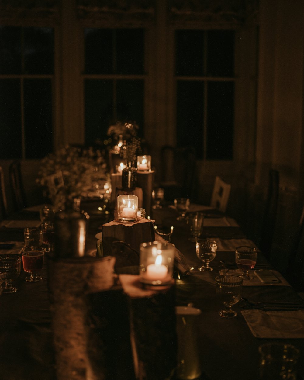 A long table lit by candles