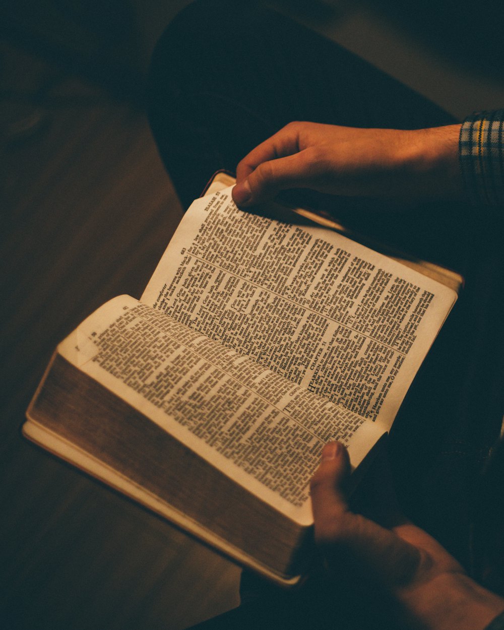A man holding an open Bible