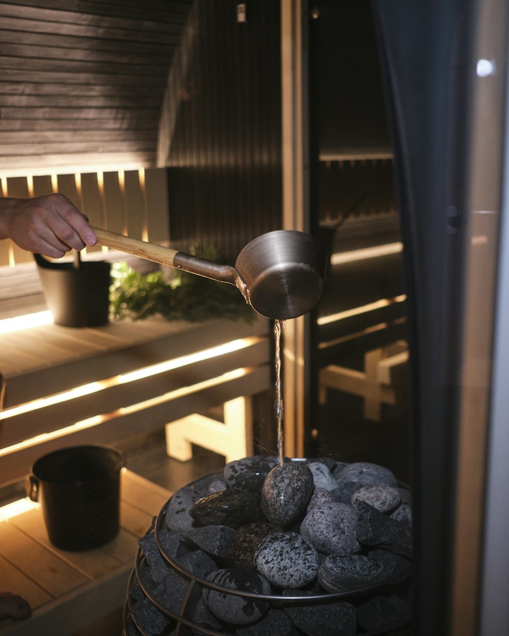 Water poured over hot stones in a sauna
