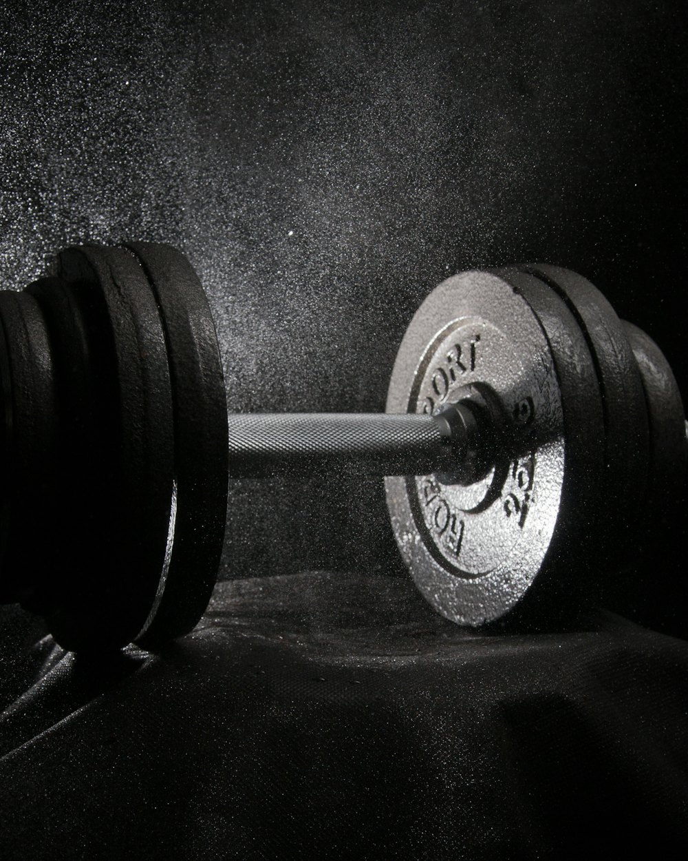 A loaded barbell in low light