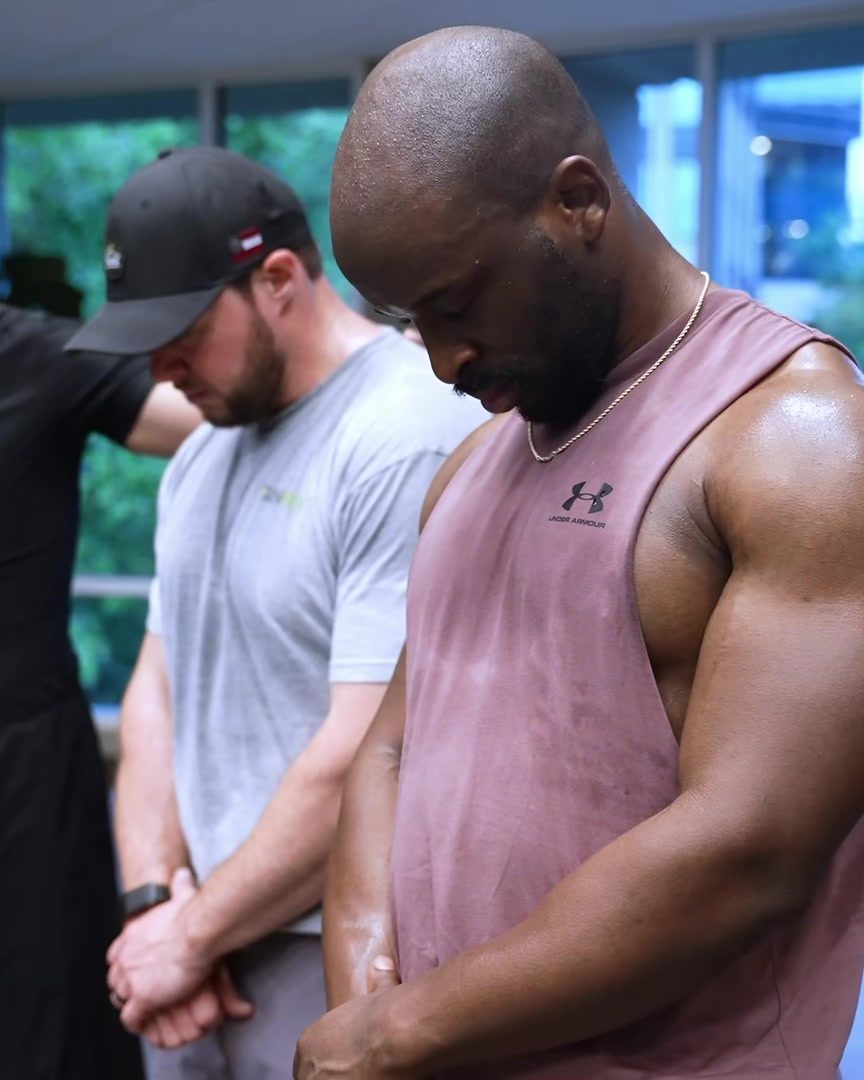 The men praying together at Iron Sharpens Iron